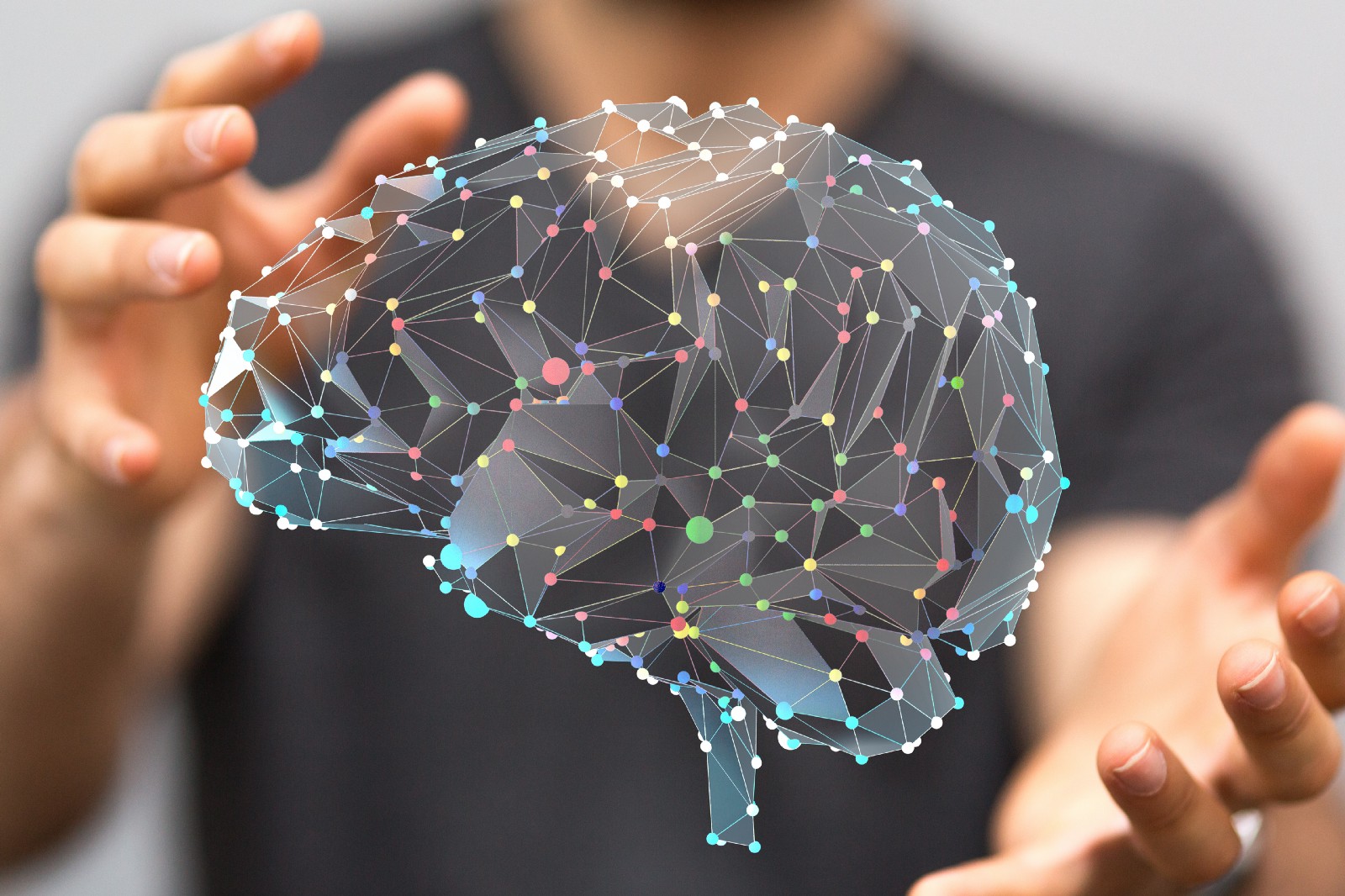 Person holding hologram brain